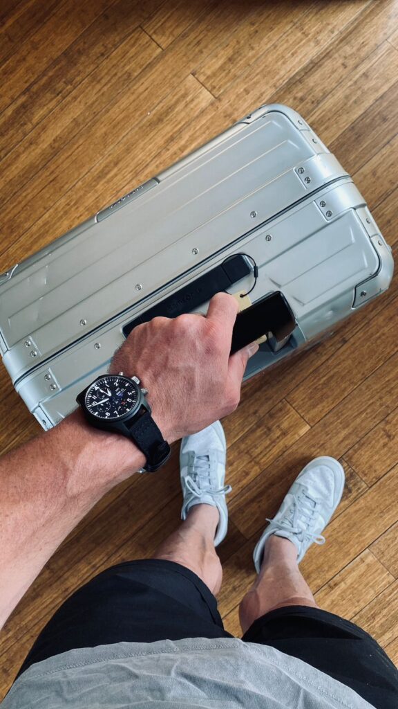 Jesse Kriel top-view of watch, Samsonite suitcase & torso
